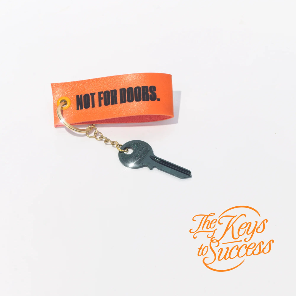 The Keys to Success keyring with a dark key