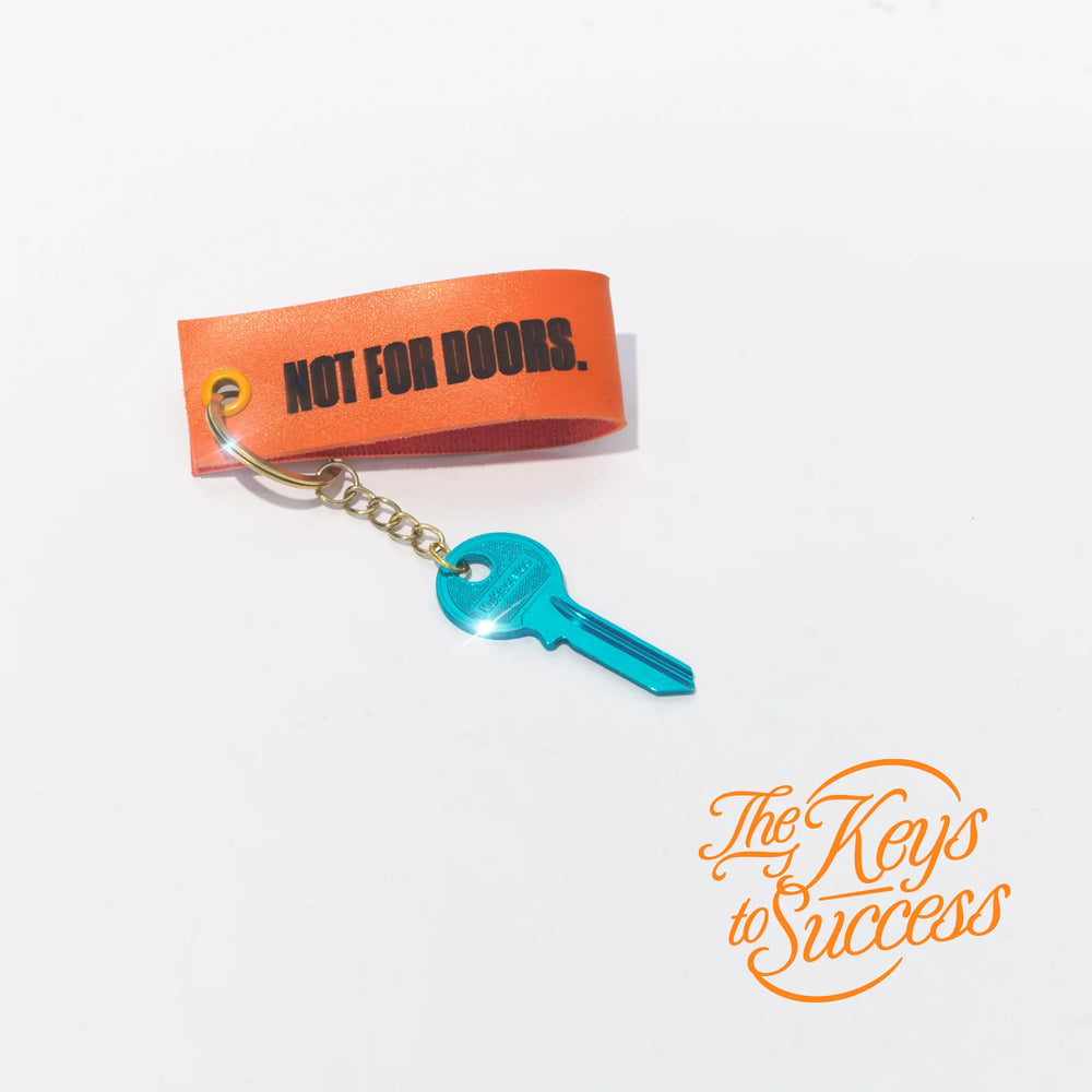 The Keys to Success keyring with a teal key