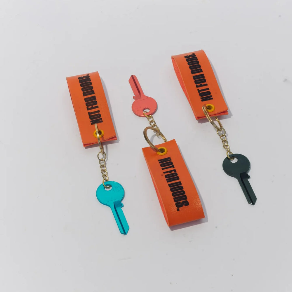 Three keyrings with their straps upright