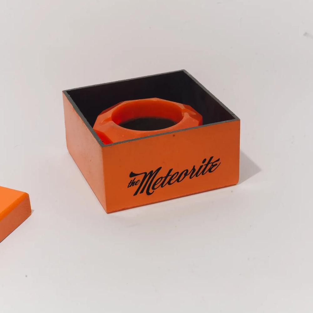 The Meteorite inside its open box, the name written on the side