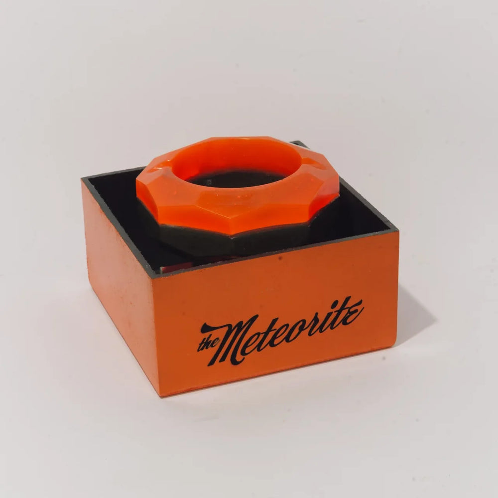 The Meteorite resting on top of its box