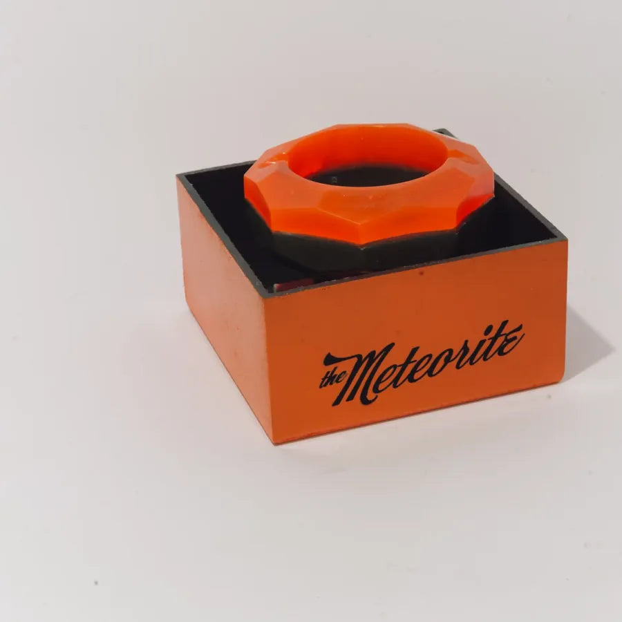 The Meteorite box, frame 6 of 6: the ashtray sitting on its box